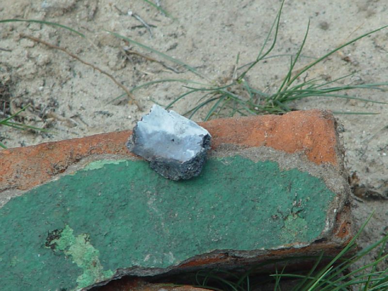 Sobibor Human remains on a green brick